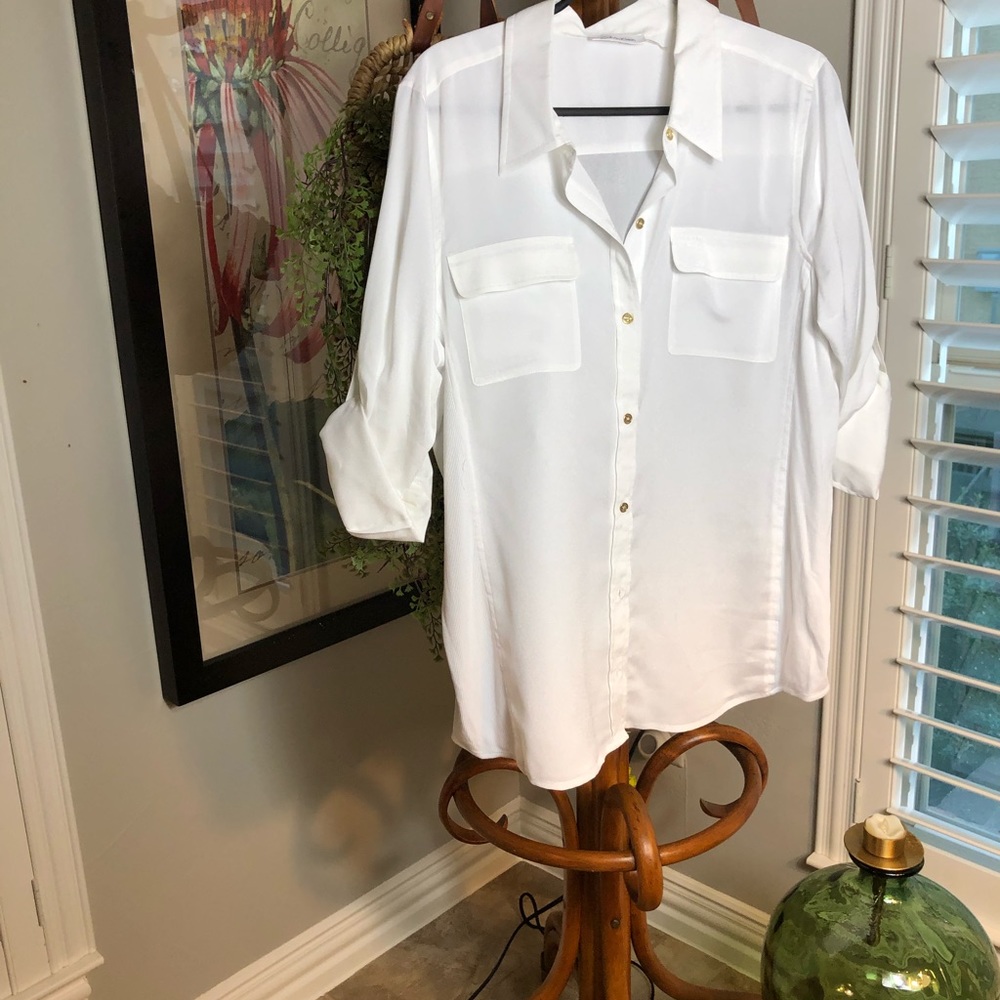 Long sleeve bright white silky button shirt.